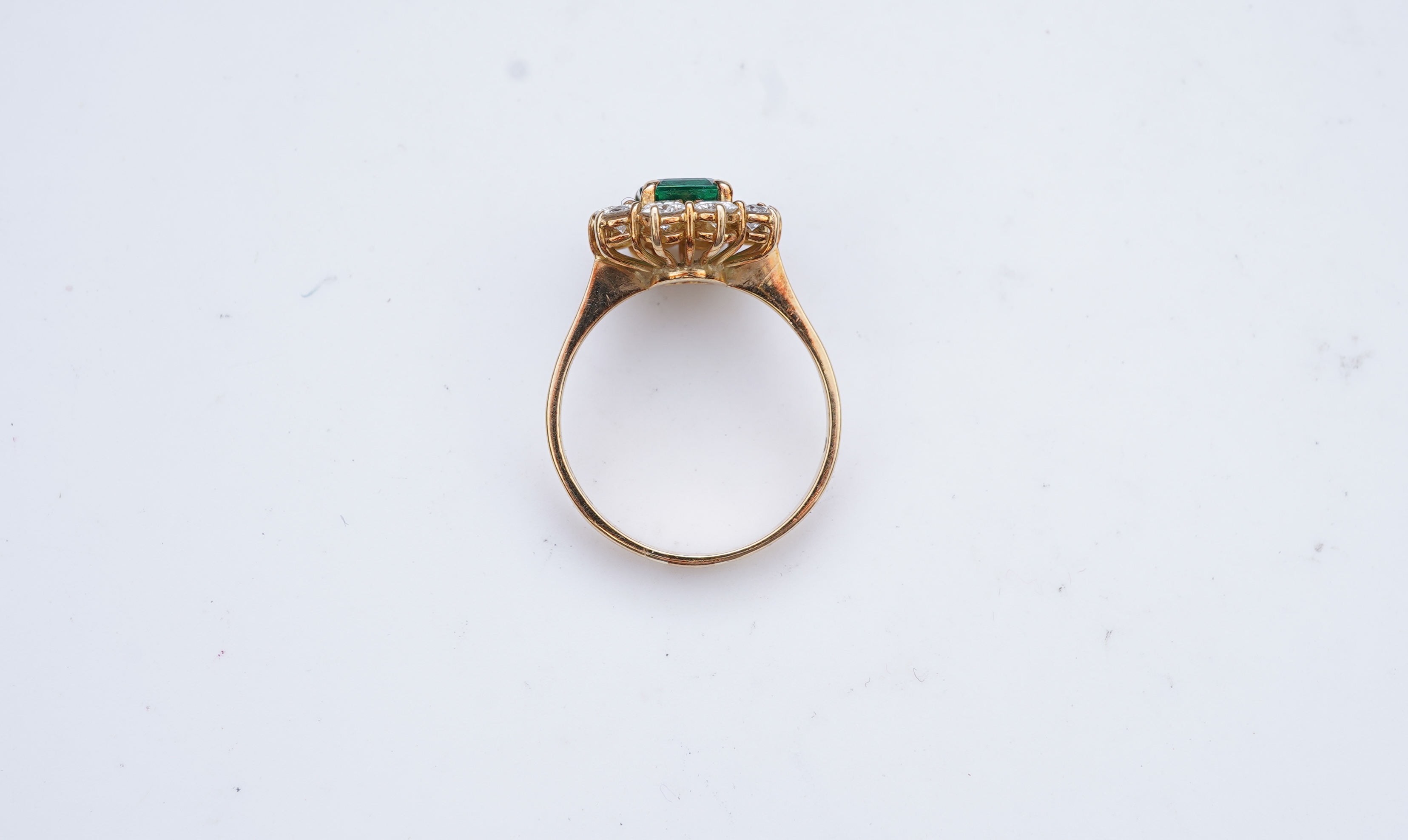 A synthetic emerald and diamond ring